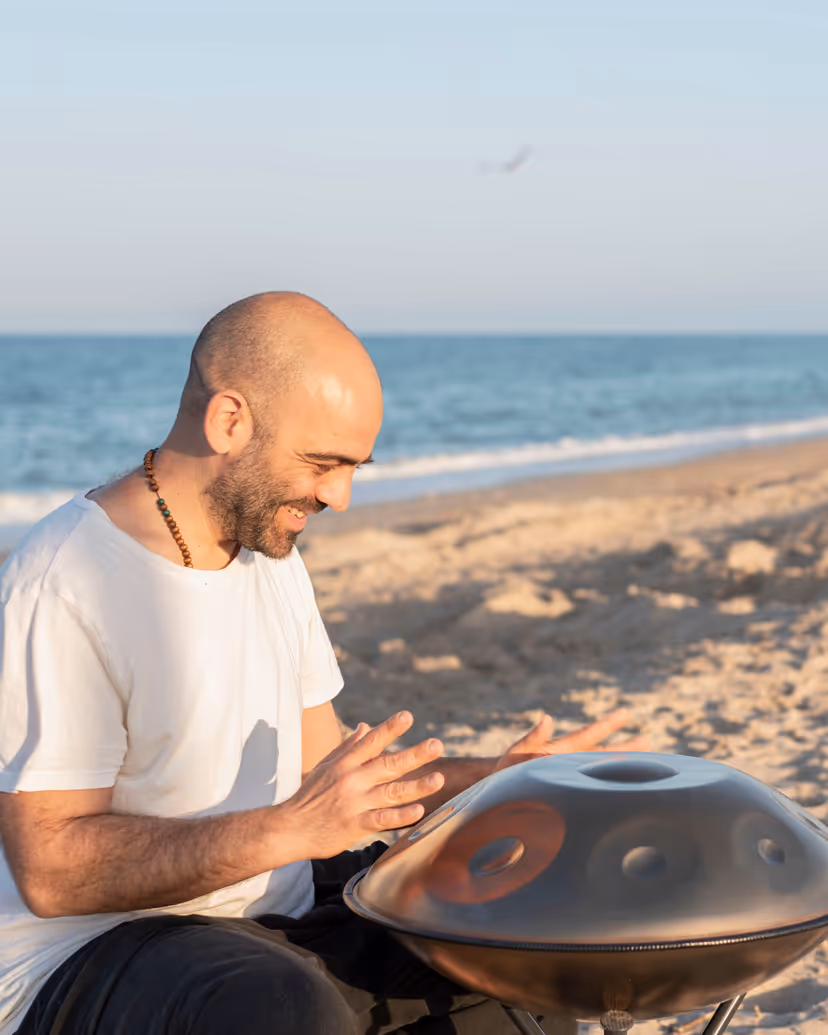 Handpan musician on the beach at sunset, Hossegor