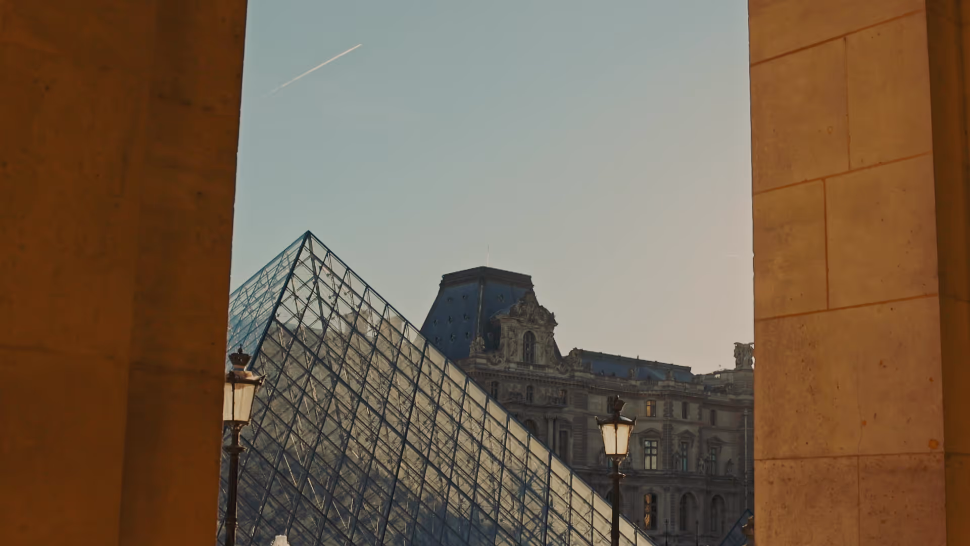 The Louvre pyramid and palace at dusk, Paris